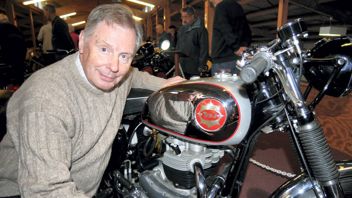 Glenn Robinson, of Grindelwald, gets a closer look at a BSA motorcycle.