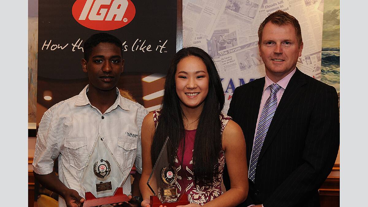 winners Getasew Ferguson and Grace Hinds with IGA Tasmania CEO Grant Hinchcliffe