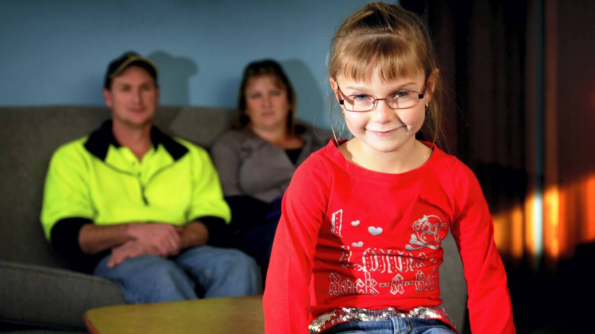  Launceston pupil Chelsea Anderson, 6, with her parents, David and Emma.