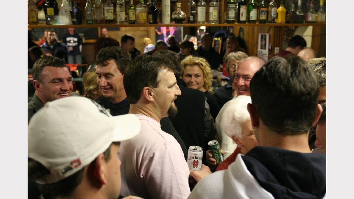Todd Russell is swamped by well-wishers at the Club Hotel at Beaconsfield last night.	