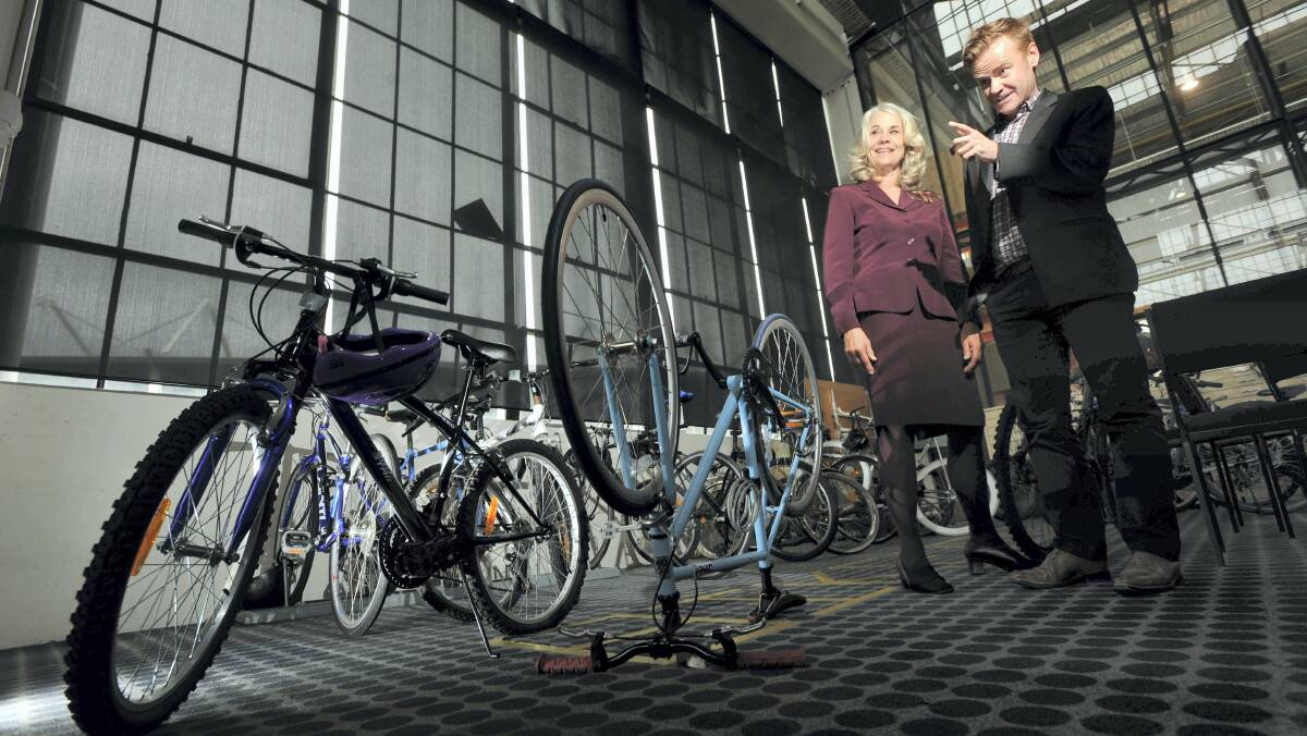 Dr Anne Lusk, of Harvard School of Public Health, and UTAS's School of Architecture senior lecturer Dr Steven Fleming talk about two wheeled transport before yesterday's lecture. Picture: SCOTT GELSTON