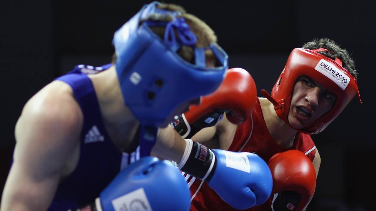 Latrobe fighter Luke Woods (in red) during the Commonwealth Games in 2010.