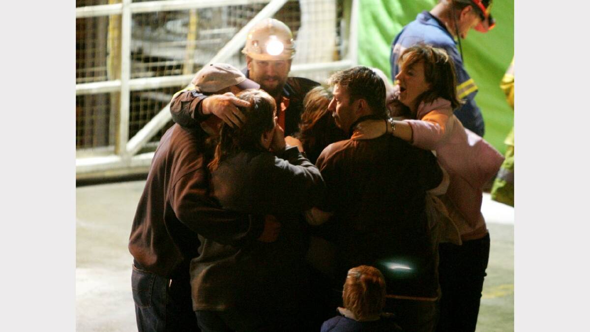 Todd Russell hugs family members after being rescued from the Beaconsfield gold mine May 9, 2006