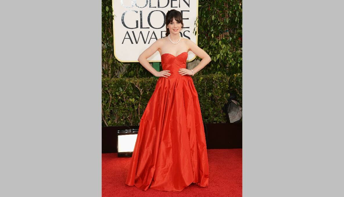 Actress Zooey Deschanel arrives at the 70th Annual Golden Globe Awards. Photo by Jason Merritt/Getty Images