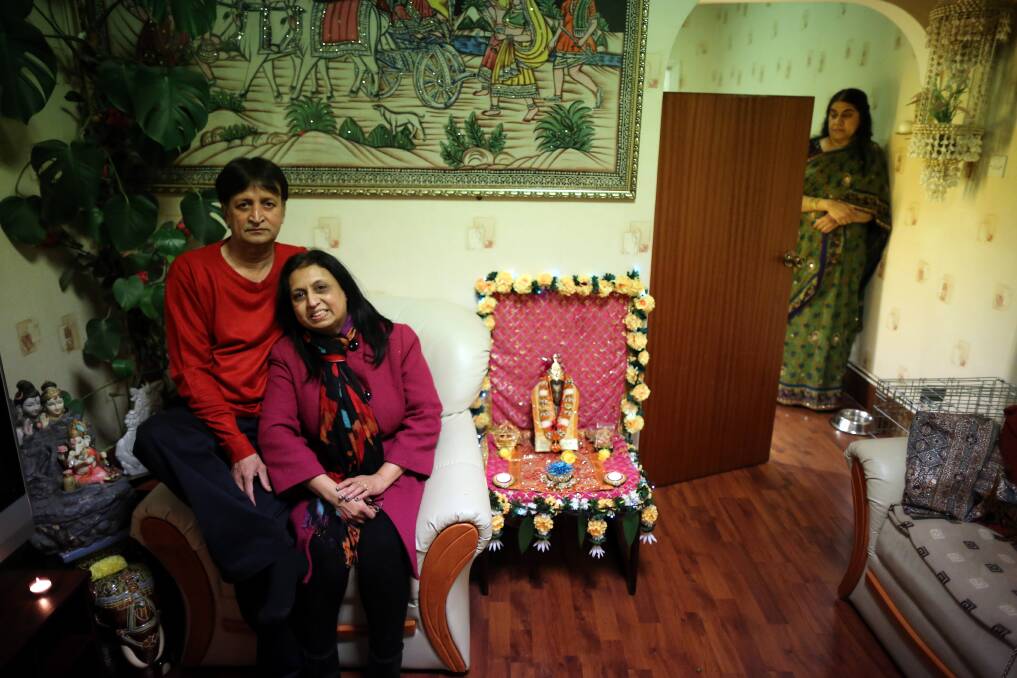 Residents Suresh Bakrania and his wife Hansa (C) pose as they sit inside their home which is decorated to celebrate the Hindu festival of Diwali on November 13, 2012 in Leicester, United Kingdom. Photo by Christopher Furlong/Getty Images