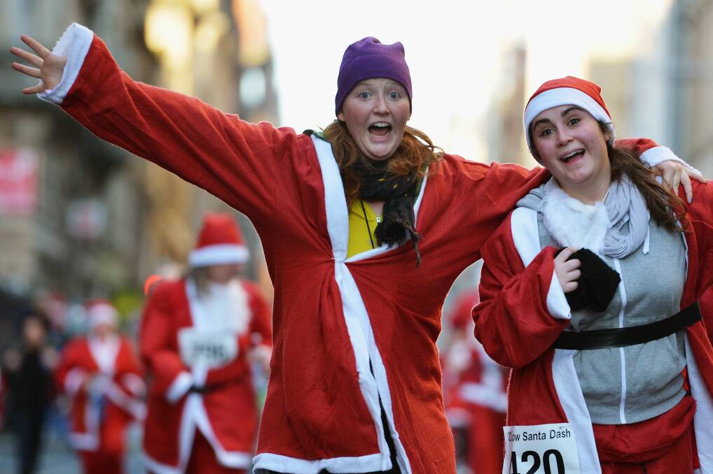 A thousand people take part in the annual Glasgow Santa Dash on November 9, 2012 in Glasgow, Scotland. Photo by Jeff J Mitchell/Getty Images