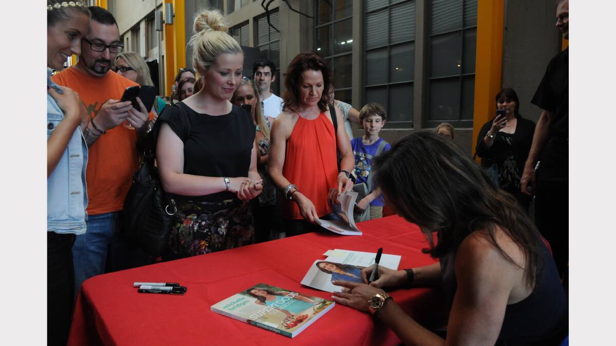 Michelle Bridges signing copies of her Superfoods Cookbook at the Queen Victoria Museum and Art Gallery yesterday. Picture: Paul Scambler