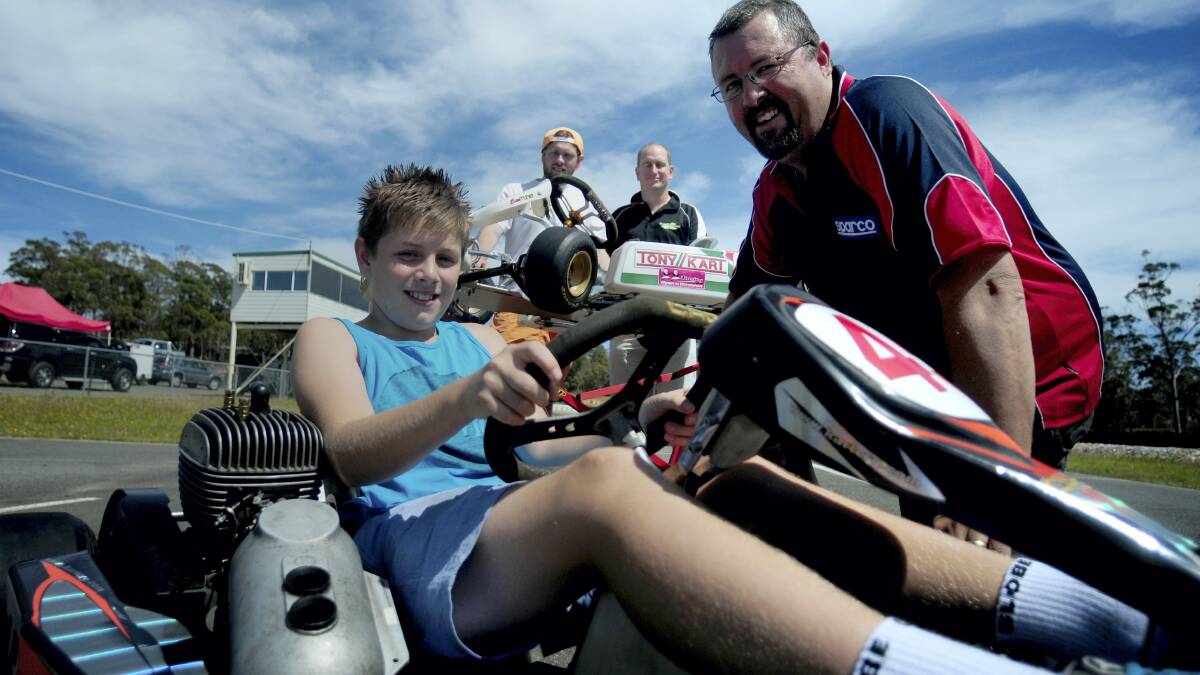 Kurtis Love, 11, Michael Jones and Jonathan Males, all of Launceston, and Stuart Lee, of Evandale, discuss Sunday's Have-A-Go day at Archerville Raceway.   Picture: PETER SANDERS