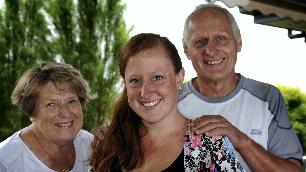 Tasmania's first IVF baby, Emma Klima, is flanked by parents Adele and Joe Klima. Picture: GEOFF ROBSON