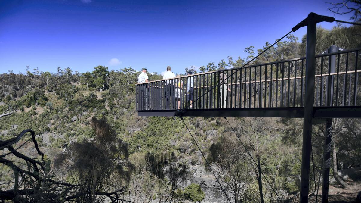 Guests on the new lookout in Cataract Gorge take in the views of the South Esk River. Picture: SCOTT GELSTON