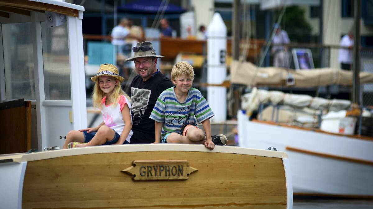 Aboard his father's boat Gryphon is Dominic Tyson, of Exeter, along with his stepchildren, seven-year-old twins Ashley and Jack Norgrove. Picture: PHILLIP BIGGS