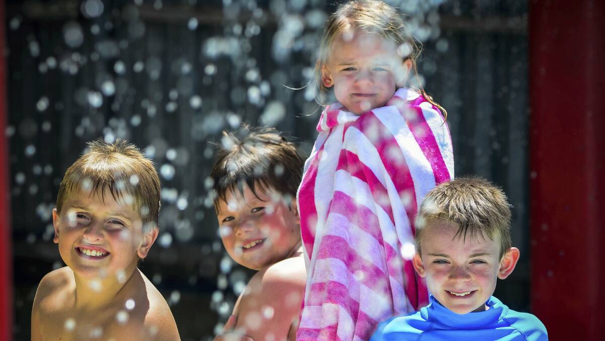 Riverside friends Kurtis McCormick, Riley Parker, Tye Clark and Bailey Clark keeping cool at the Riverside Pool yesterday. Picture: PHILLIP BIGGS