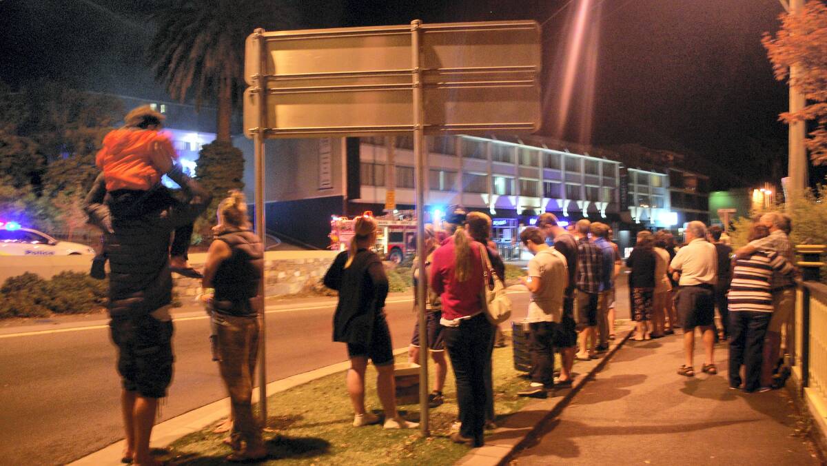 Onlookers at a fire near the Hotel Launceston, in Brisbane Street, last night.