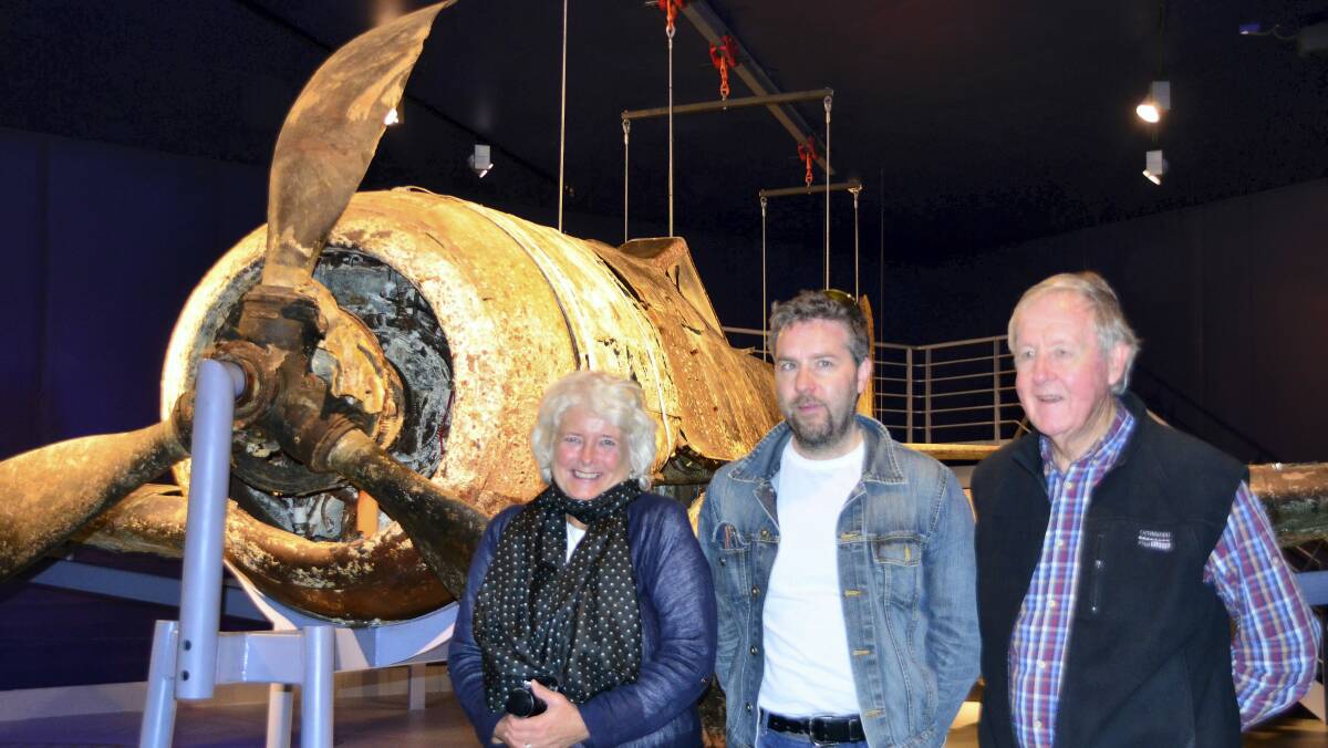 Caroline Rundle, Norwegian historian Kjell Arve Vorland and former Tasmanian premier Tony Rundle at the air museum at Herdla airfield where German fighters were stationed. The aircraft is a salvaged Fw109 shot down by the allies.