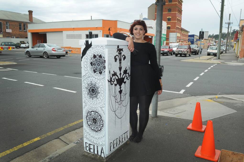 Bella Perkett with the art she drew on the York Street traffic box.