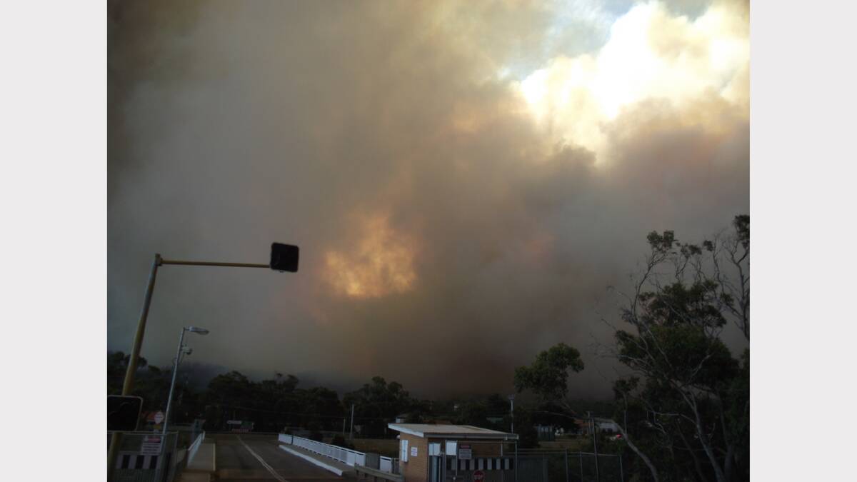 ''Fire front impact imminent, view from Dunalley bridge''.