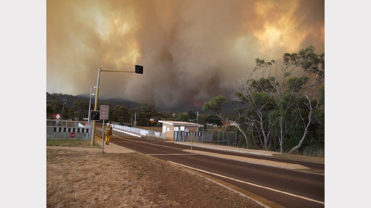 ``Fire front impacting Dunalley (my vehicle charged with asset protection of bridge and pub).''