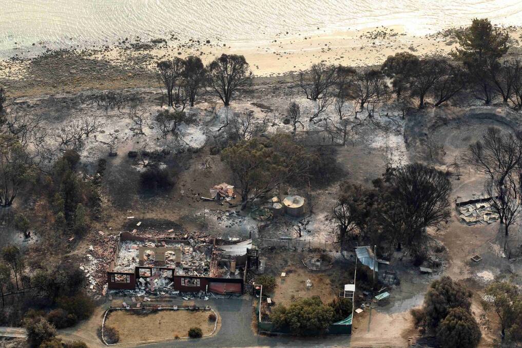 Houses destroyed by a bushfire are seen in ruins in Dunalley.