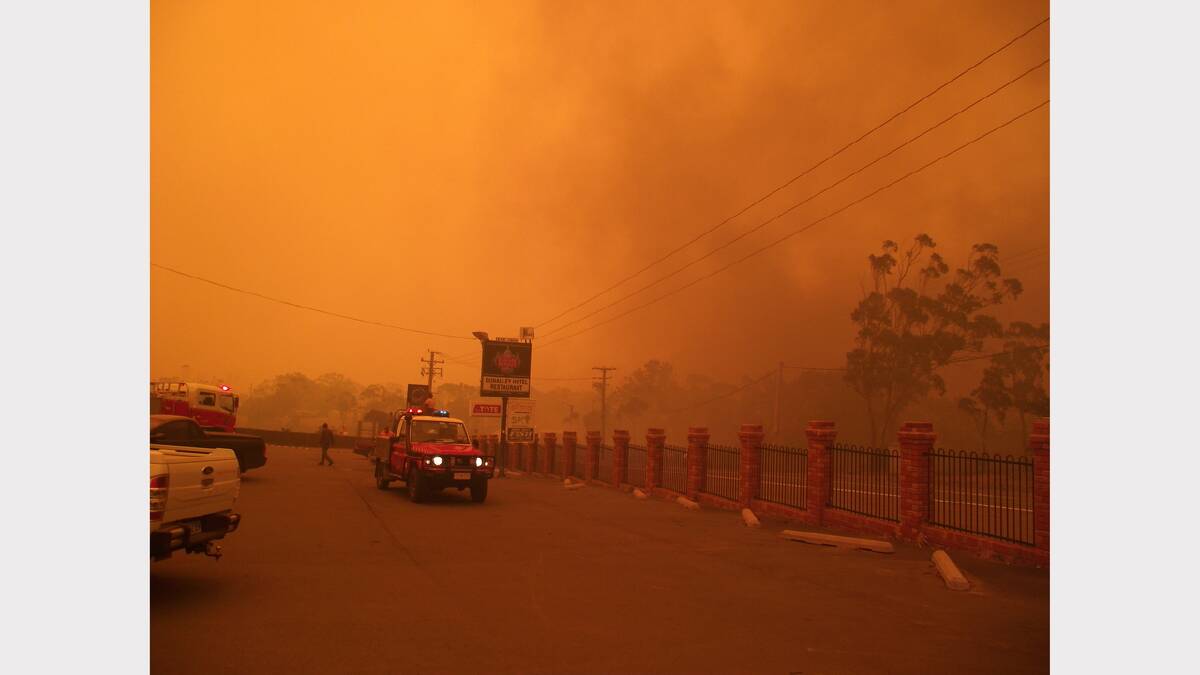 ''Defending Dunalley pub and bridge as fire front impacts Dunalley over bridge''.